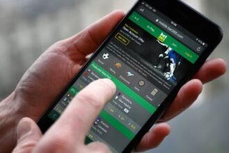 a man betting on bet365 on his smartphone