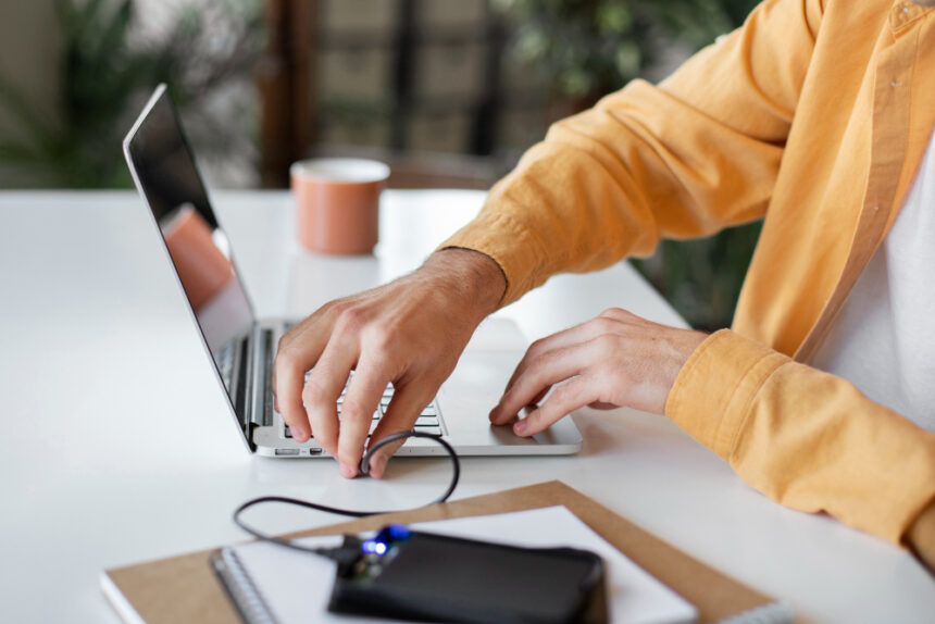 a guy connecting laptop to the dsl internet