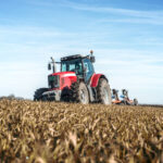 Tractor agricultural machine cultivating field